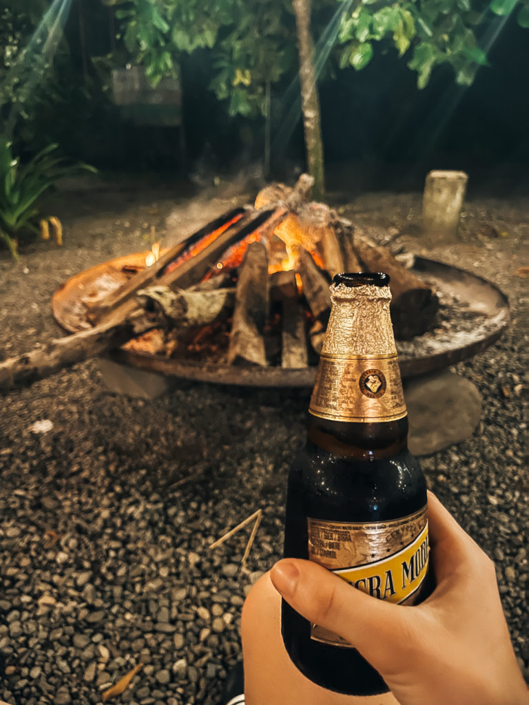 Costa Rican beer by the bonfire at Puerto Viejo Selina hostel
