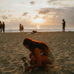 La Punta sunset with dog and girl