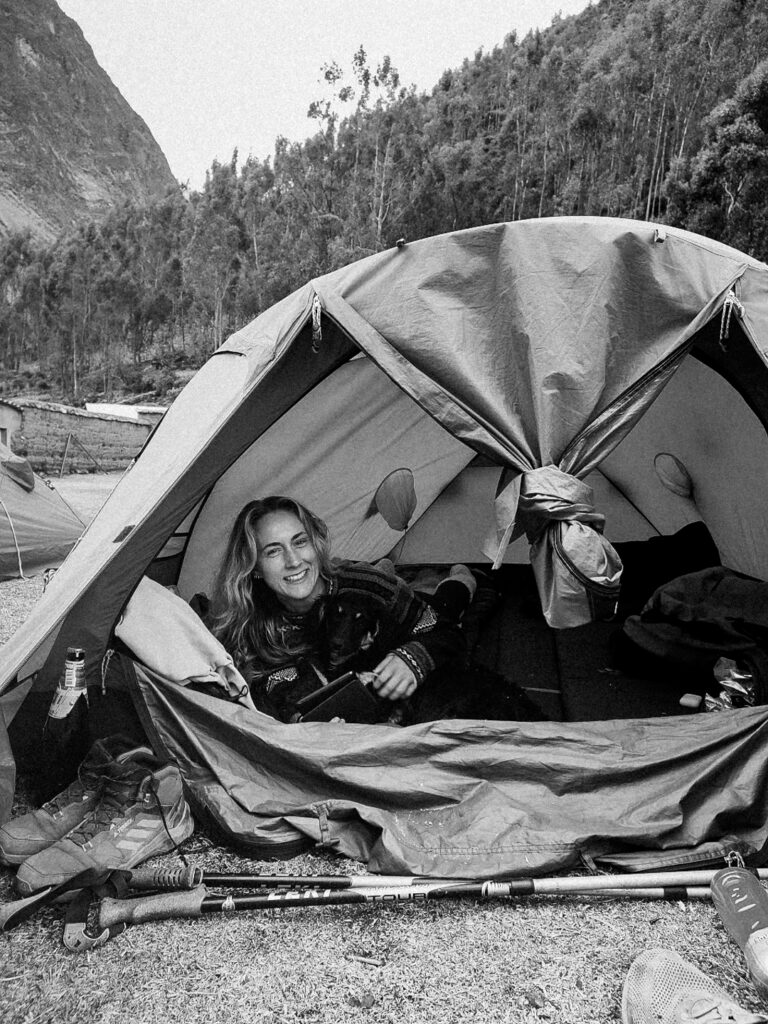 Girl in her tent camping during the Cordillera Huayhuash trek in Huaraz Peru