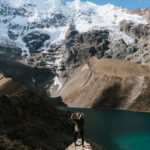 women trekking alone in Peru standing in front of Humantay lake