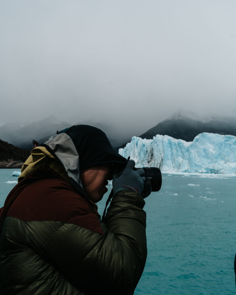 A man photographs Perito Moreno glacier