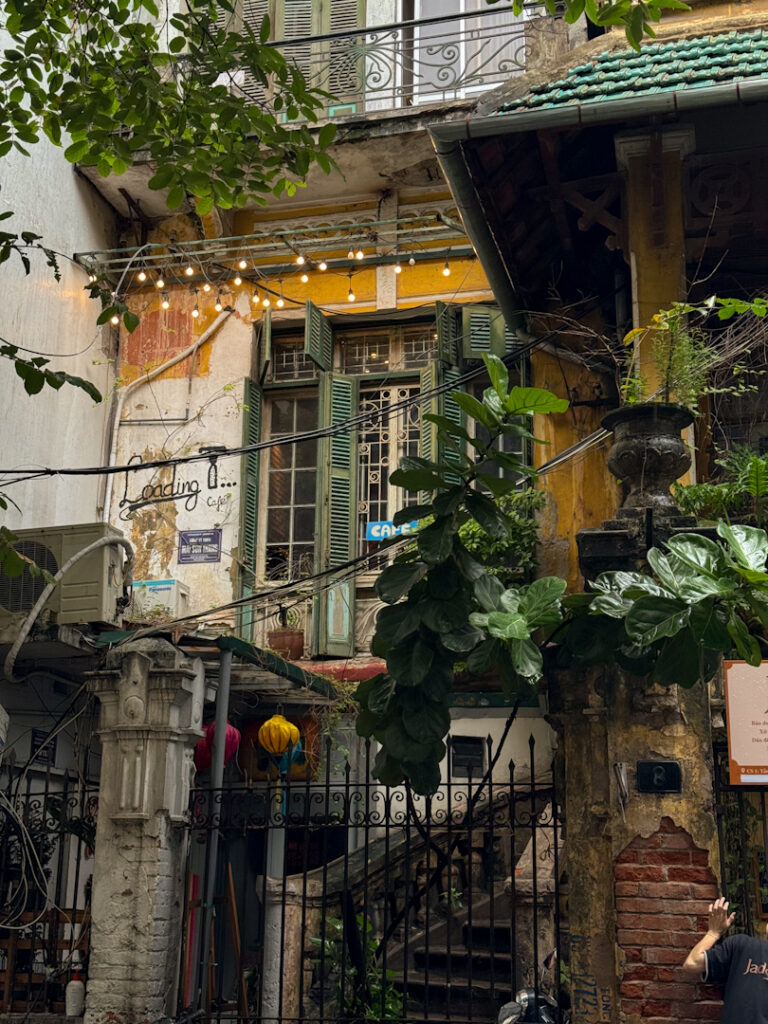 Yellow vintage building in Hanoi Vietnam, Loading T Zone Cafe Entrance